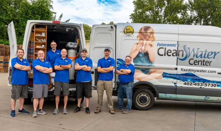Futuramic's Clean Water Center Team in front of service vans