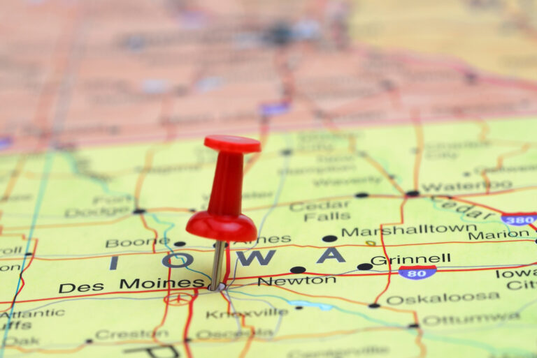 Photo of pinned Des Moines on a map of USA.